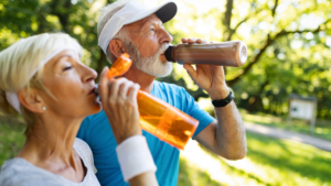 elderly couple drinking water